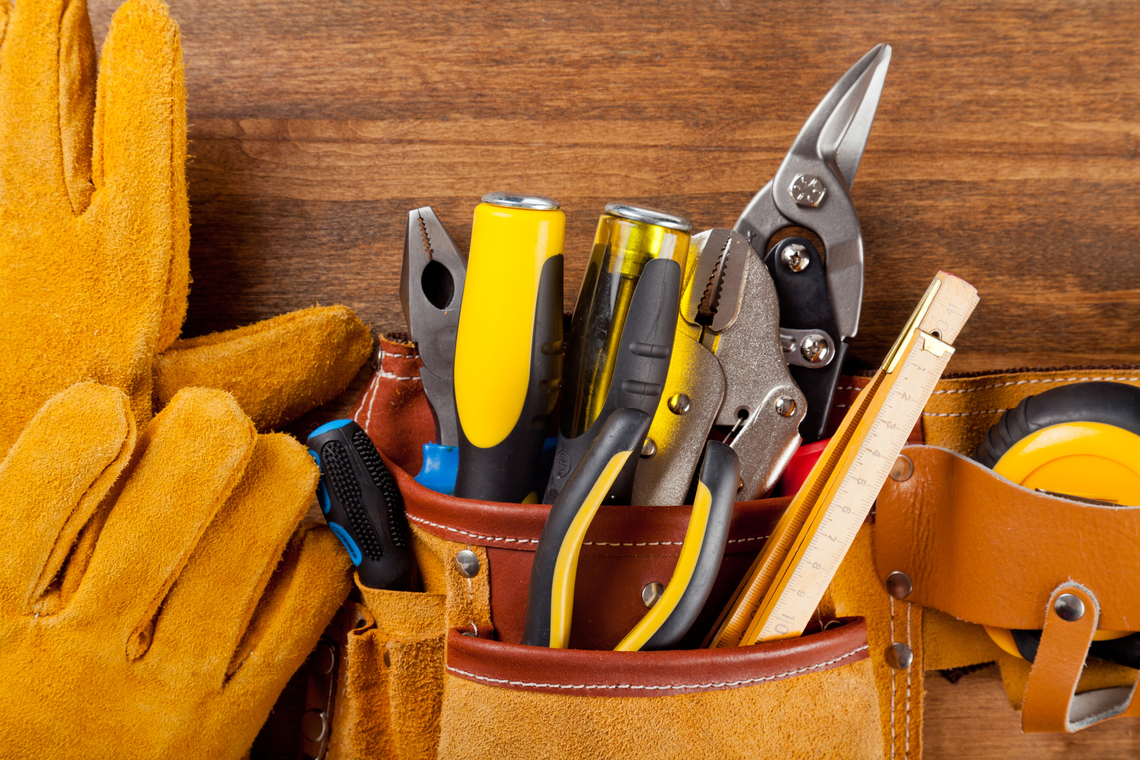 Work Gloves And Stuffed Tool Belt Close-up