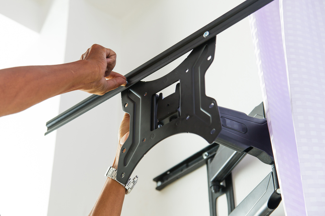 Man Installing Mount TV